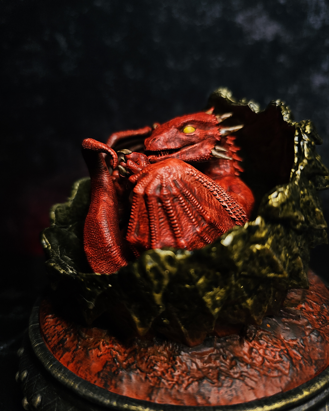 Hand-painted close-up of a red baby dragon inspired by Meleys House of the Dragon and dragon eggs from the Targaryen fantasy universe.