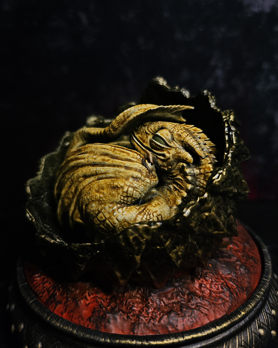 Detailed close-up of a hand-painted baby dragon figurine inspired by Syrax House of the Dragon and fantasy dragon eggs collectibles.