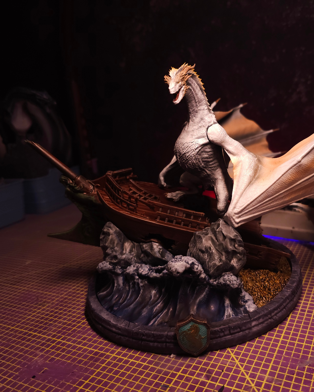 Close-up of Seasmoke dragon figurine featuring textured silver scales, sharp teeth, and detailed fantasy resin sculpting.