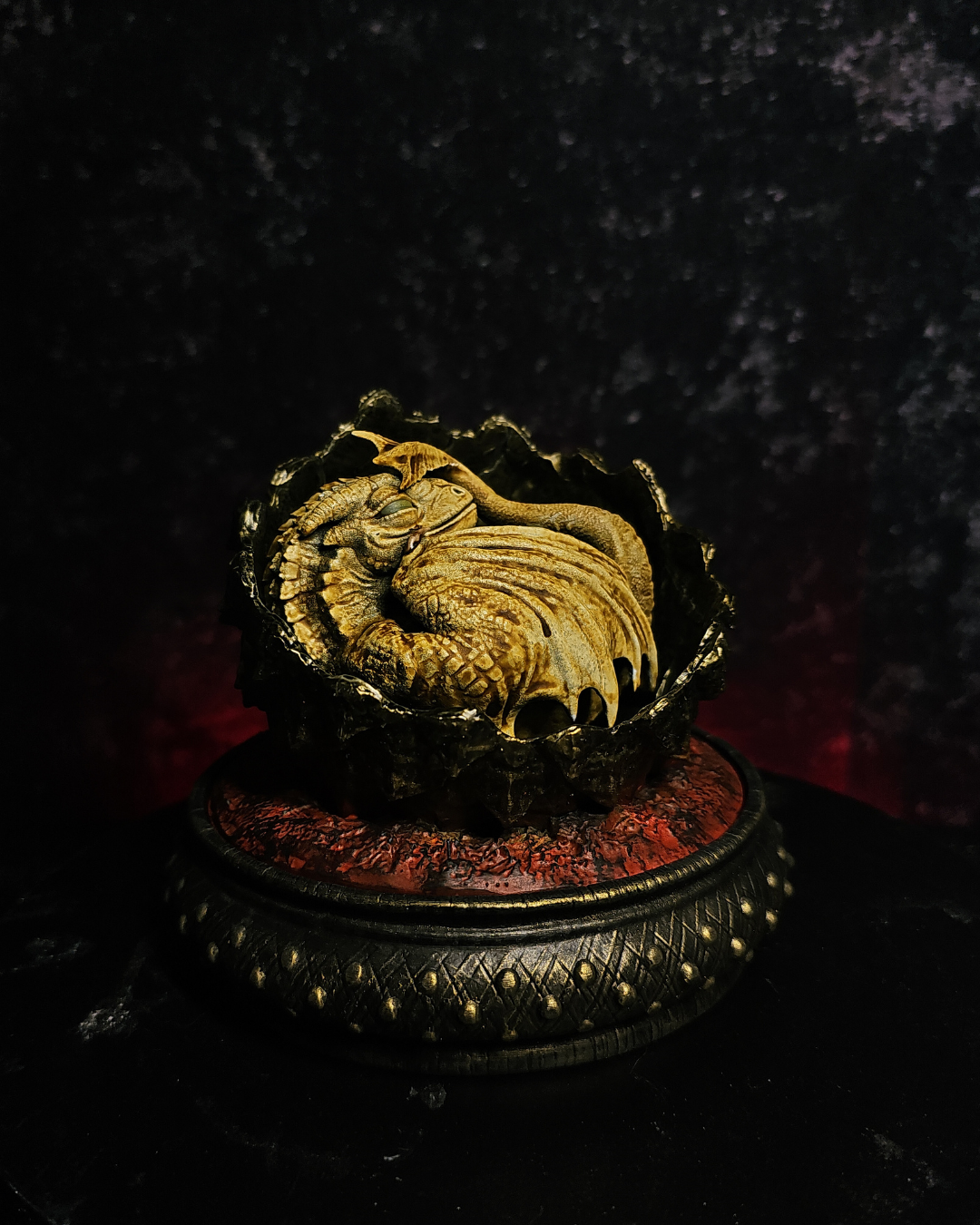 Fantasy baby dragon sleeping inside a cracked dragon egg inspired by Rhaenyra and House of the Dragon season 3. Hand-painted resin collectible.